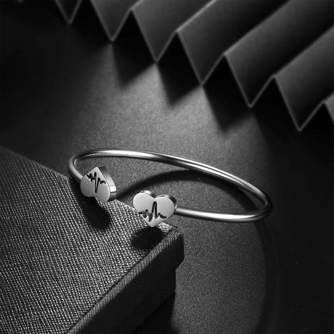 Pulseira feminina com punho aberto e coração, joia de aço inoxidável
